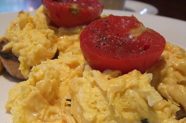 close up of scrambled eggs and tomato